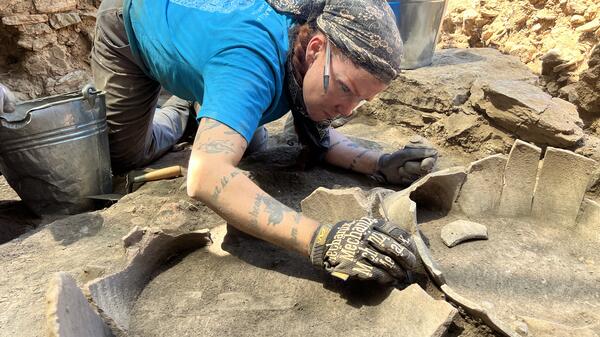 Brazeal works on an archeological site.