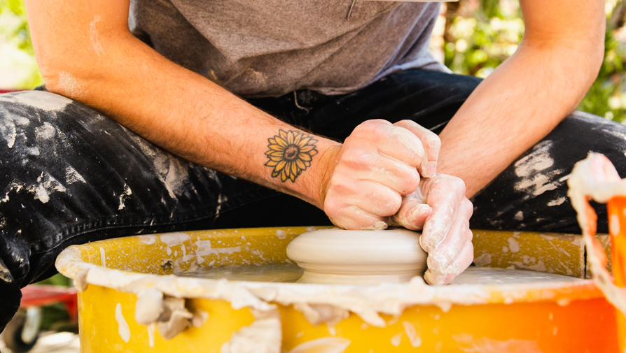 hands on pottery wheel