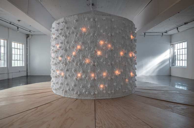 Sound Shatters the Illusion  July 13 - Sept 10, 2023  10’ x 26’ x 26’  Pillar Wax, Glassine Paper, Pine Wood  Site:  Artpace